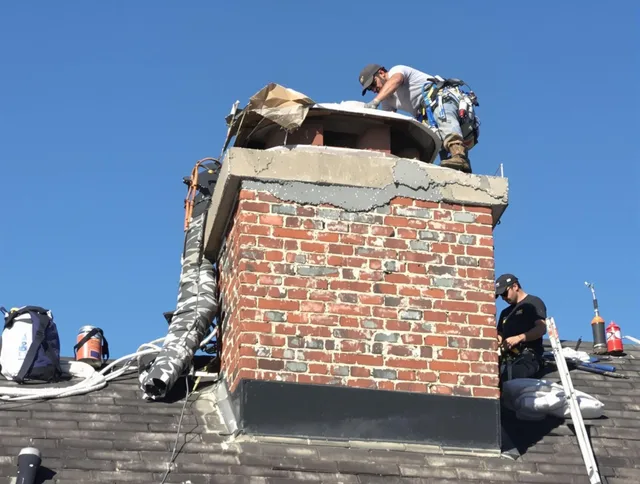 Lakeville Chimney Sweep installing a custom chimney crown in Lakeville, MA