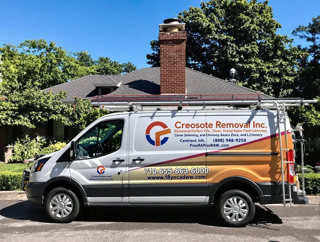 Lakeville Chimney Sweep technician removing creosote safely in Lakeville, MA