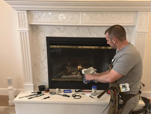 Lakeville Chimney Sweep performing fireplace maintenance in Lakeville, MA