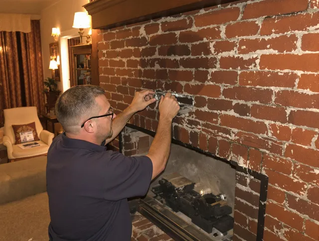 Lakeville Chimney Sweep expert fixing a fireplace in Lakeville, MA